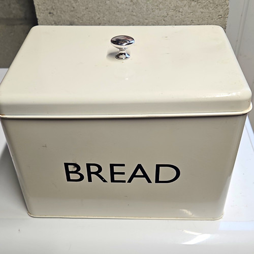 White metal bread bin with - bread,